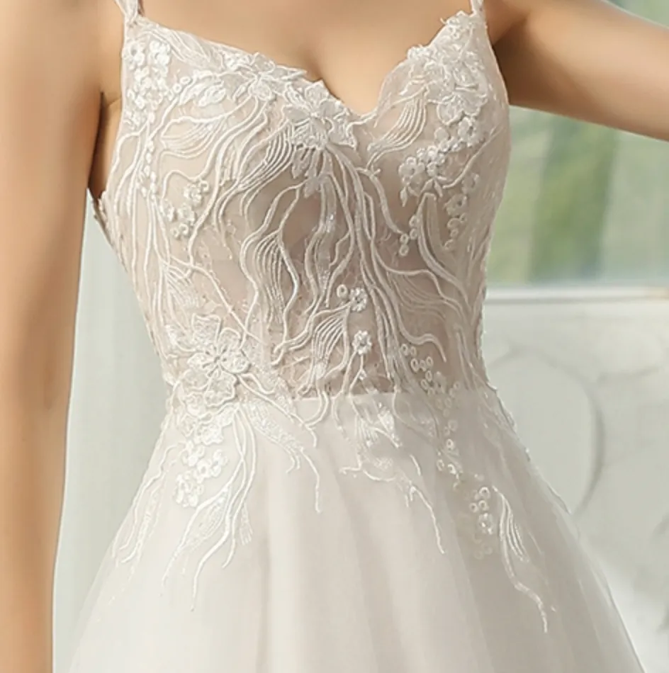 Cap Sleeve Wedding Dress With Glittery Appliqués